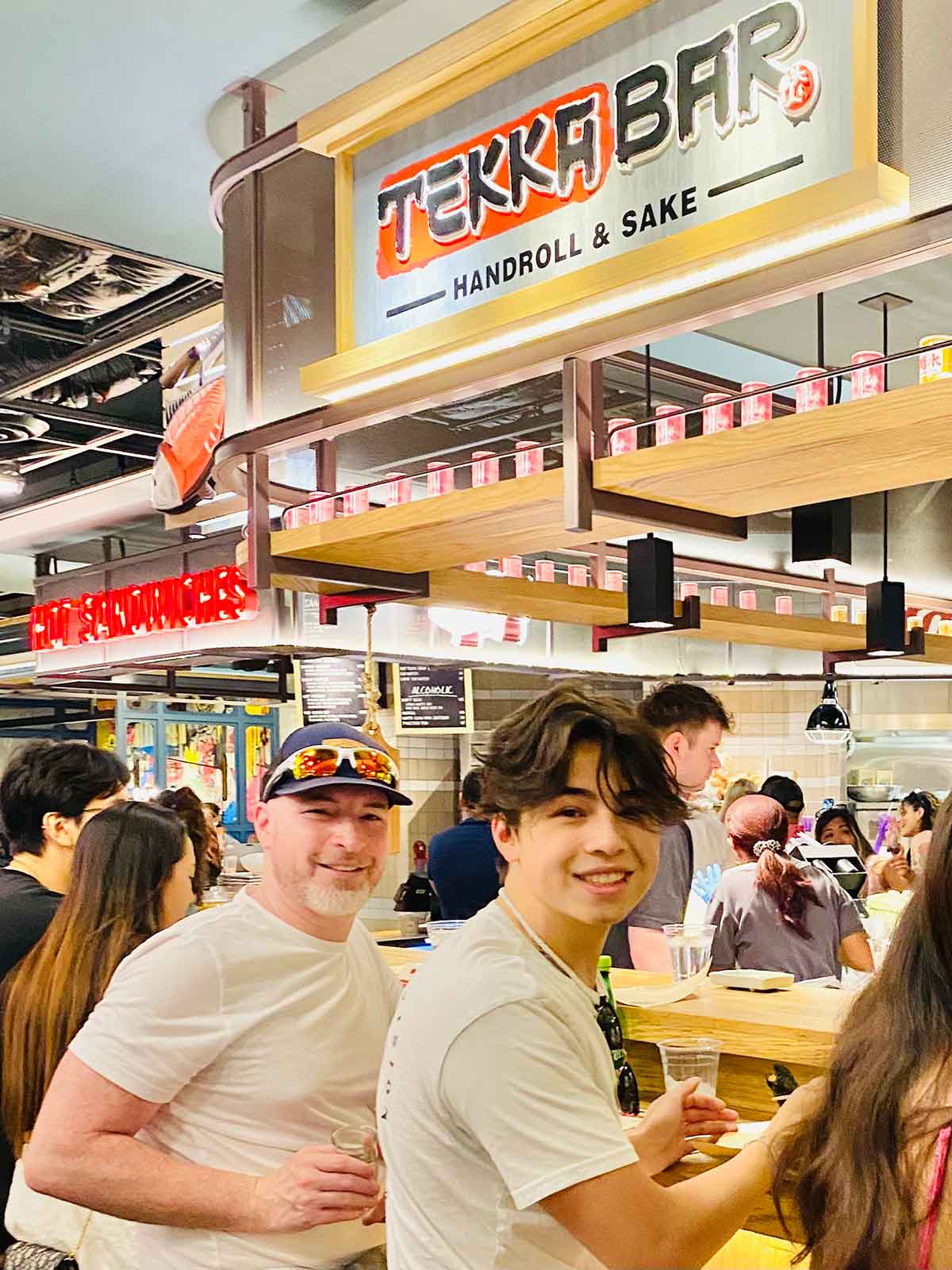 Dad and son at Cosmopolitan hotel food court.